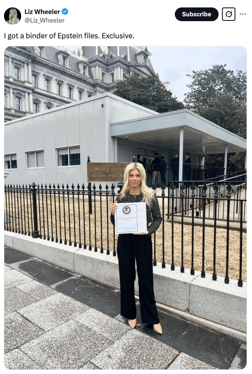 Liz Wheeler holding a Jeffrey Epstein binder
